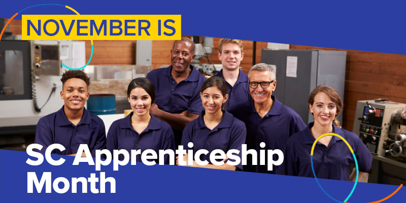 seven apprentices in blue shirts of various ages and ethnicities